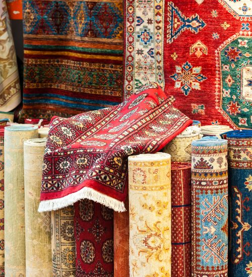 Carpets variety selection rolled up rugs shop store.